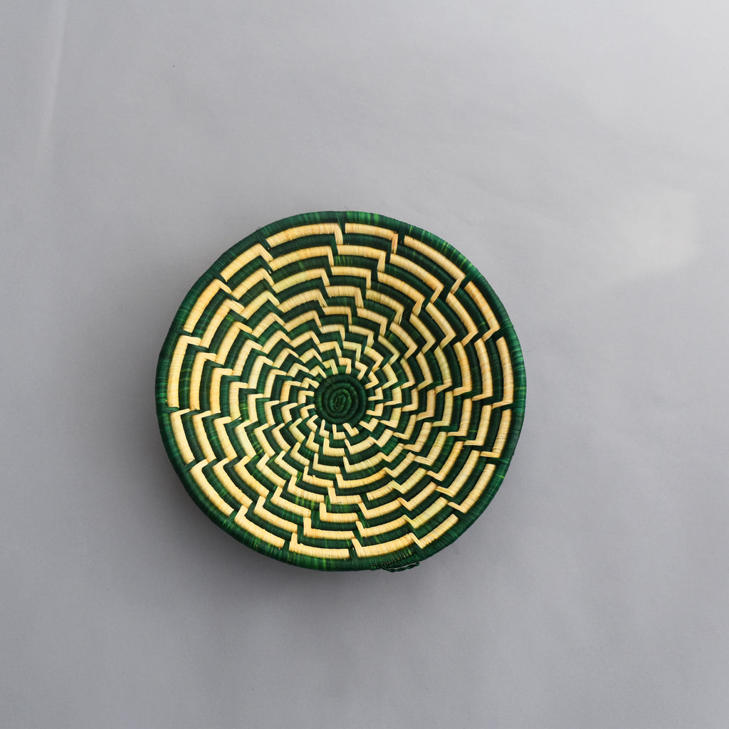 Hand woven straw. A tradition and art which has been part of Ugandan culture for centuries.  With all of the materials used being natural products or recycled, we also believe this is a lovely way of making use of natural resources the world has to offer and making positive changes to become more sustainable.  Beautifully, unique, handmade basket made out of banana stalks and raffia fibres also known as the Ugandan basket.