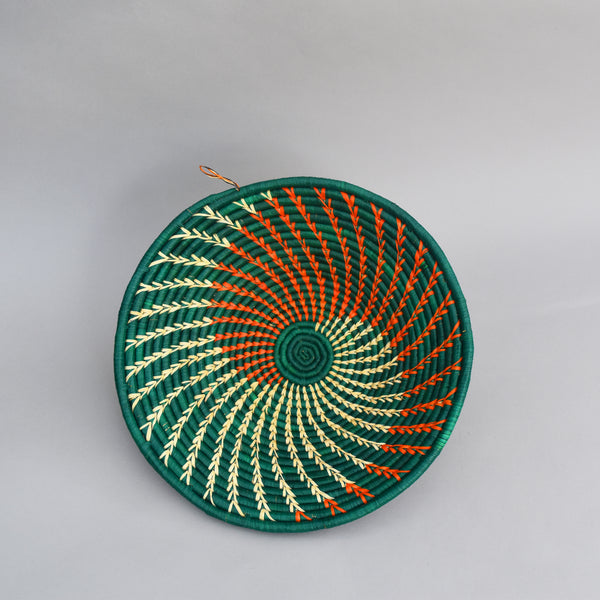 Hand woven straw. A tradition and art which has been part of Ugandan culture for centuries.  With all of the materials used being natural products or recycled, we also believe this is a lovely way of making use of natural resources the world has to offer and making positive changes to become more sustainable.  Beautifully, unique, handmade basket made out of banana stalks and raffia fibres also known as the Ugandan basket.