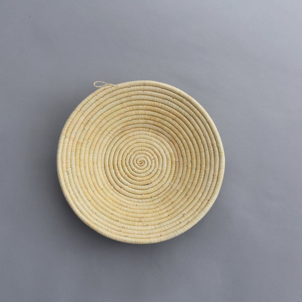 Hand woven straw. A tradition and art which has been part of Ugandan culture for centuries.  With all of the materials used being natural products or recycled, we also believe this is a lovely way of making use of natural resources the world has to offer and making positive changes to become more sustainable.  Beautifully, unique, handmade basket made out of banana stalks and raffia fibres also known as the Ugandan basket.