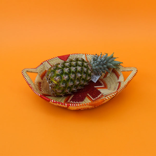This carefully hand-woven fruit baskets is made of Elephant straw. No basket is the same, each piece has been handcrafted in Bolga, Ghana. There may be some imperfections but that is due to the fact that they are handmade.  Not only is it straw basket or bowl great for storing your fruit and vegetables, It can be used for quiet a number of things including storing bits & bobs and decorating. A stylish way to keep clutter away in the house.  It is 100% eco-friendly and practical and versatile.