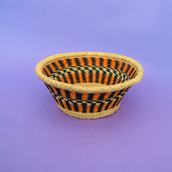 Multifunctional fruit basket for storing and decorating. This carefully hand-woven fruit baskets is made of Elephant straw. No basket is the same, each piece has been handcrafted in Bolga, Ghana. There may be some imperfections but that is due to the fact that they are handmade.  Not only is it straw basket or bowl great for storing your fruit and vegetables, It can be used for quiet a number of things including storing bits & bobs and decorating. A stylish way to keep clutter away in the house.