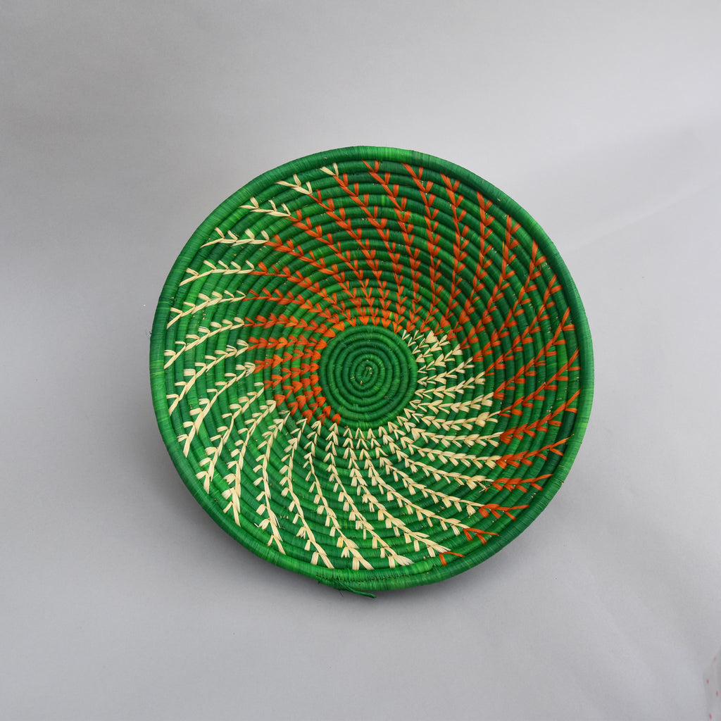 Hand woven straw. A tradition and art which has been part of Ugandan culture for centuries.  With all of the materials used being natural products or recycled, we also believe this is a lovely way of making use of natural resources the world has to offer and making positive changes to become more sustainable.  Beautifully, unique, handmade basket made out of banana stalks and raffia fibres also known as the Ugandan basket. 