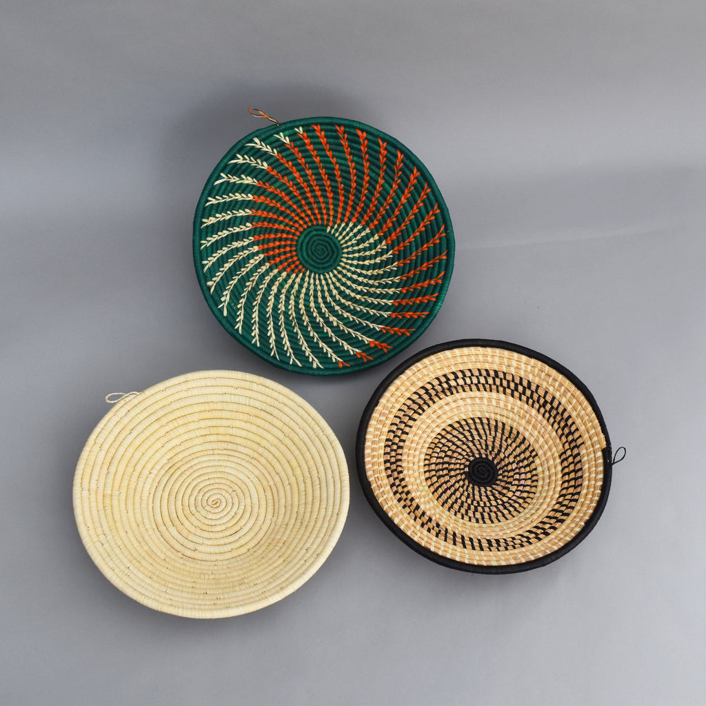 Hand woven straw. A tradition and art which has been part of Ugandan culture for centuries.  With all of the materials used being natural products or recycled, we also believe this is a lovely way of making use of natural resources the world has to offer and making positive changes to become more sustainable.  Beautifully, unique, handmade basket made out of banana stalks and raffia fibres also known as the Ugandan basket. 