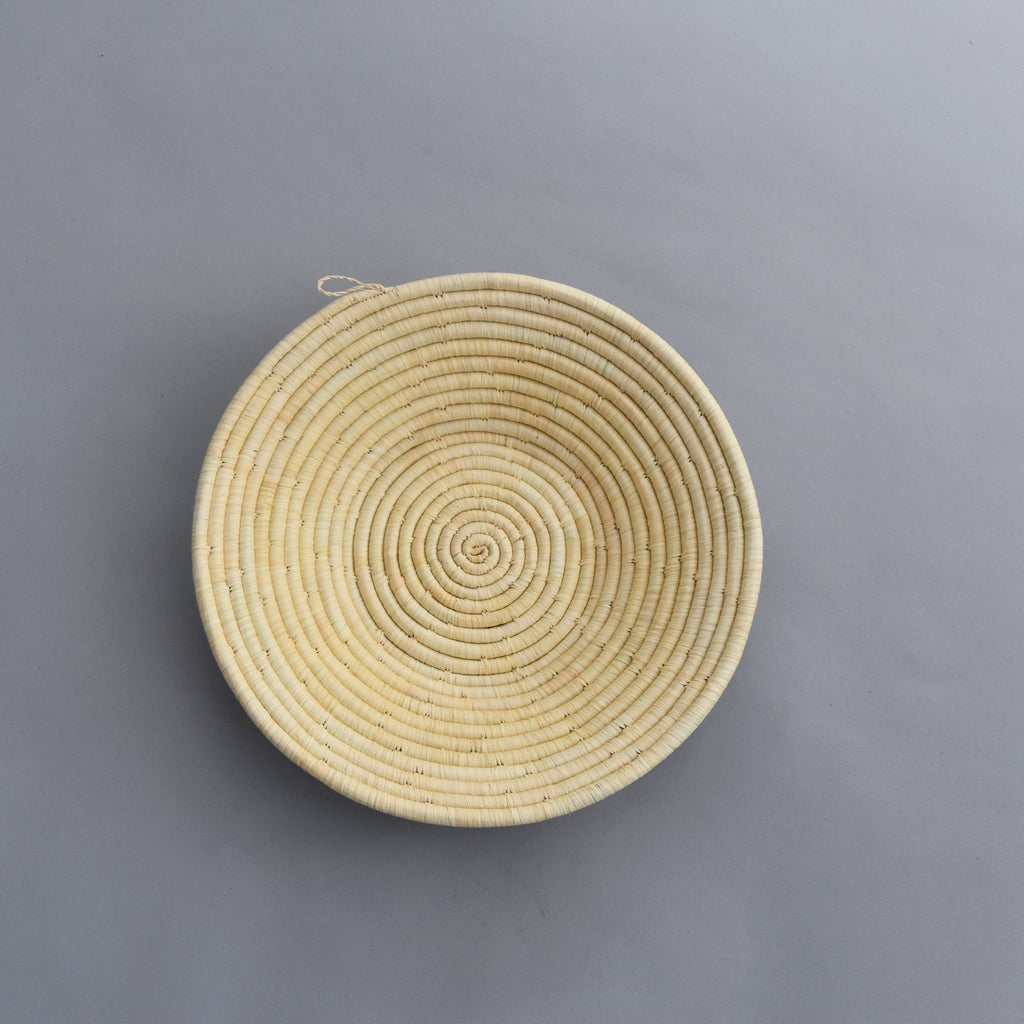 Hand woven straw. A tradition and art which has been part of Ugandan culture for centuries.  With all of the materials used being natural products or recycled, we also believe this is a lovely way of making use of natural resources the world has to offer and making positive changes to become more sustainable.  Beautifully, unique, handmade basket made out of banana stalks and raffia fibres also known as the Ugandan basket. 