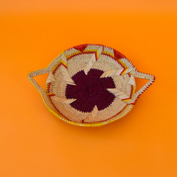  This carefully hand-woven fruit baskets is made of Elephant straw. No basket is the same, each piece has been handcrafted in Bolga, Ghana. There may be some imperfections but that is due to the fact that they are handmade.  Not only is it straw basket or bowl great for storing your fruit and vegetables, It can be used for quiet a number of things including storing bits & bobs and decorating. A stylish way to keep clutter away in the house.  It is 100% eco-friendly and practical and versatile.