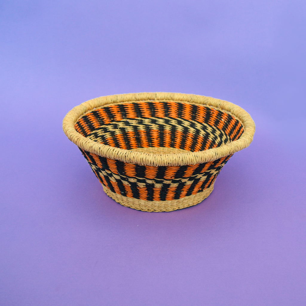 Multifunctional fruit basket for storing and decorating. This carefully hand-woven fruit baskets is made of Elephant straw. No basket is the same, each piece has been handcrafted in Bolga, Ghana. There may be some imperfections but that is due to the fact that they are handmade.  Not only is it straw basket or bowl great for storing your fruit and vegetables, It can be used for quiet a number of things including storing bits & bobs and decorating. A stylish way to keep clutter away in the house.