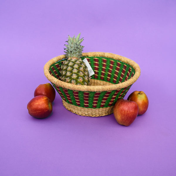 Multifunctional fruit basket for storing and decorating. This carefully hand-woven fruit baskets is made of Elephant straw. No basket is the same, each piece has been handcrafted in Bolga, Ghana. There may be some imperfections but that is due to the fact that they are handmade.  Not only is it straw basket or bowl great for storing your fruit and vegetables, It can be used for quiet a number of things including storing bits & bobs and decorating. A stylish way to keep clutter away in the house.